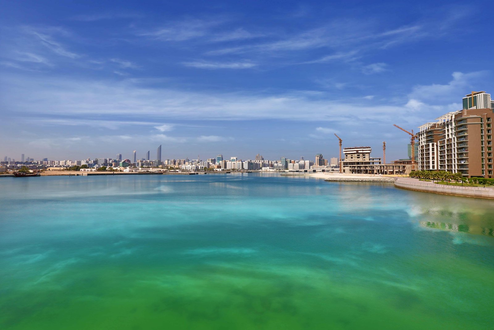 RAK Tower Al Reem Island exterior showcasing luxury high-rise apartments with waterfront marina views in Abu Dhabi.